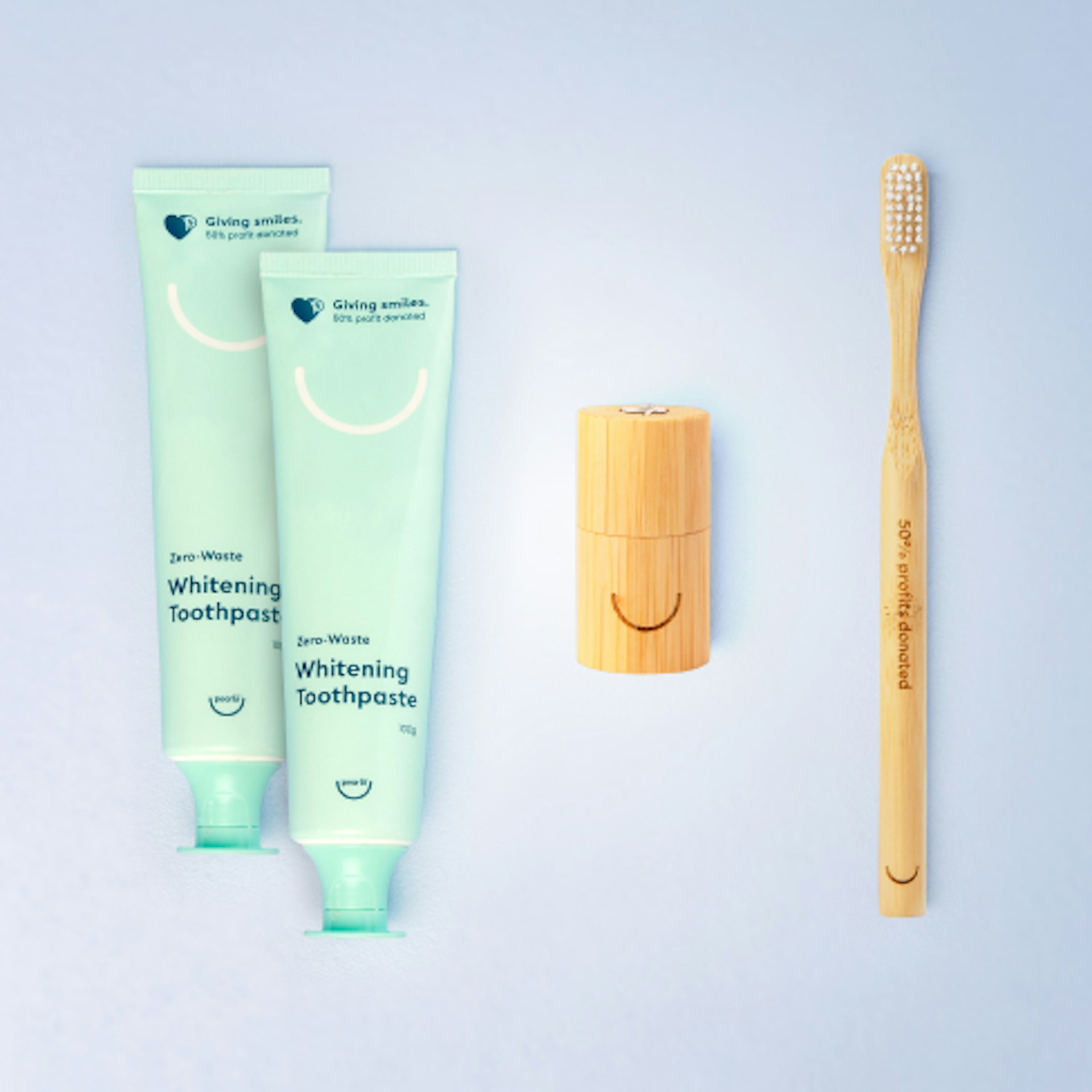 Marketing image of Pearlii's Essential Pack bundle, displaying 2x Zero-Waste Whitening Toothpaste, 1x Moso Dental Floss and 1x Mosobrush