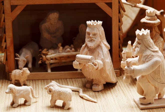 An image depicting the Pesebre - a small town made of basic materials such as paper, paint, glue and small figure of religious characters or animals. 
