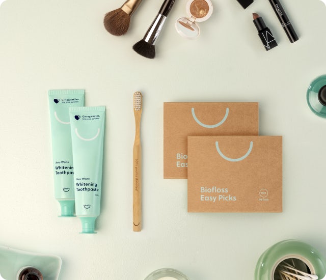 Pearlii products display photo showing Zero-Waste Whitening Toothpaste, Mosobrush and Biofloss Easy Picks, along with other bathroom accessories. 