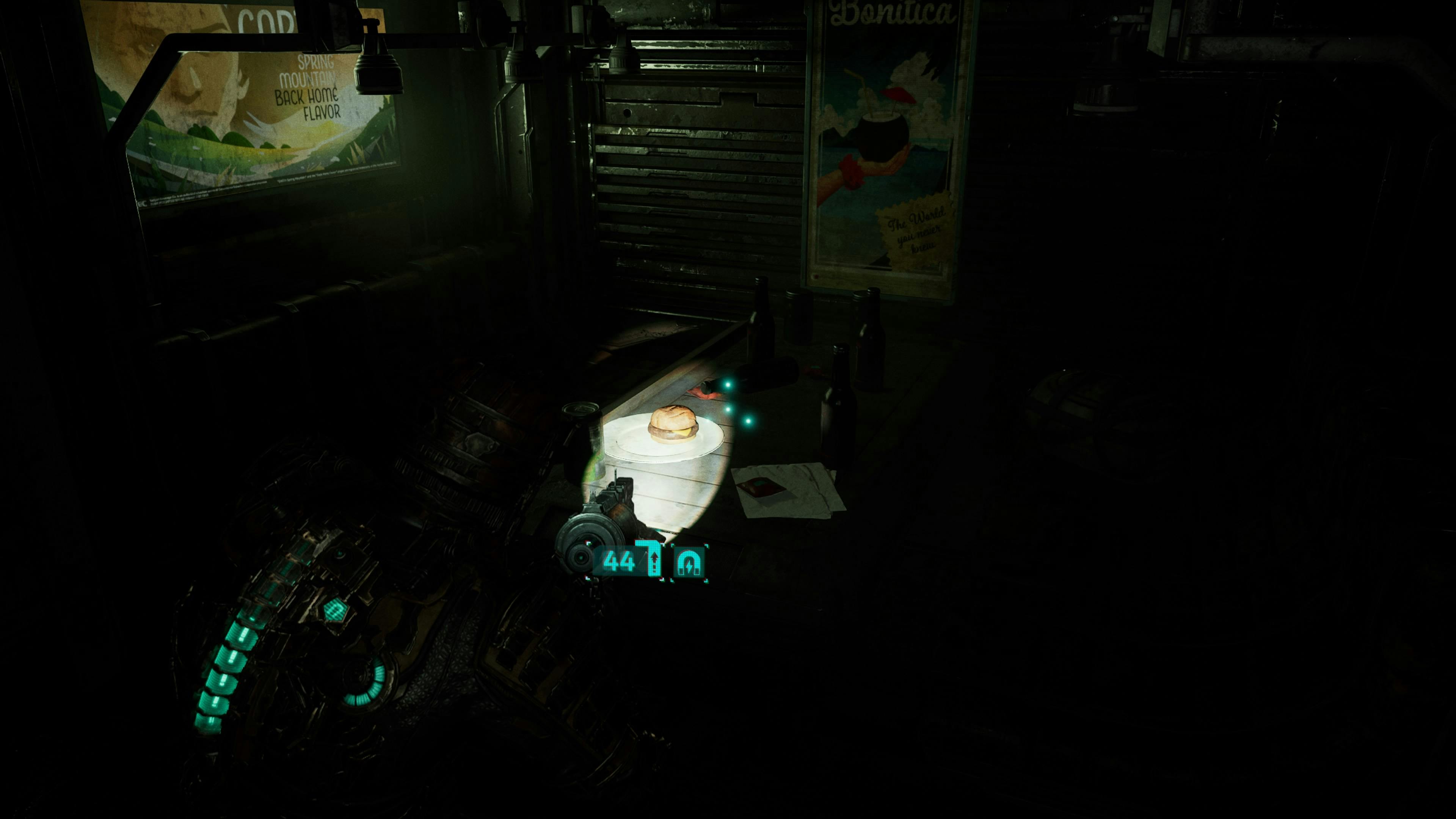 Dead Space screenshot. Isaac is pointing his light/gun at a burger sitting on a table on the Ishimura.