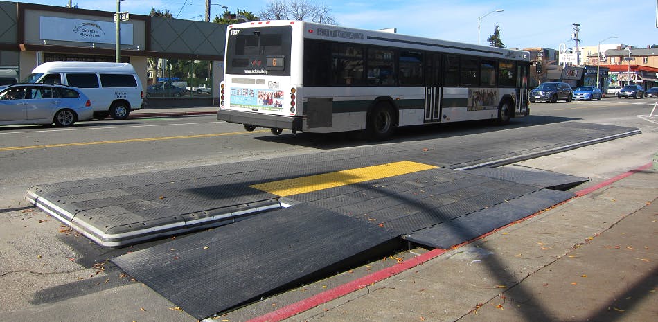 That’s a protected bike lane behind the bus stop. 