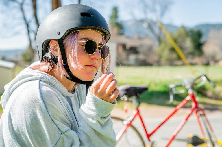 A young rider takes a moment to enjoy nature.