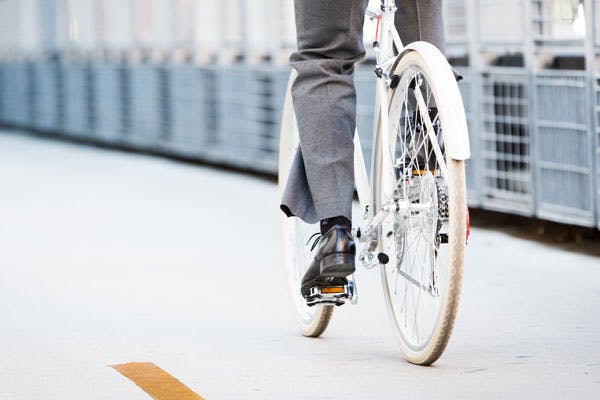 A worker commutes to work by bike.