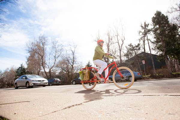 Woman riding an electric bike.