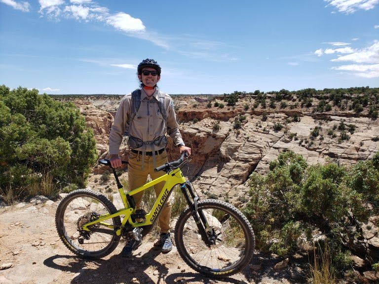 Blake Baker, an Outdoor Recreation Planner at the Bureau of Land Management’s Price Field Office in Utah, with an electric mountain bike.