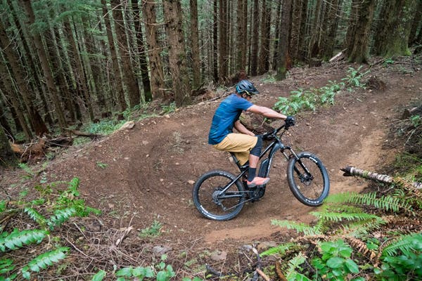 Riding an electric mountain bike.