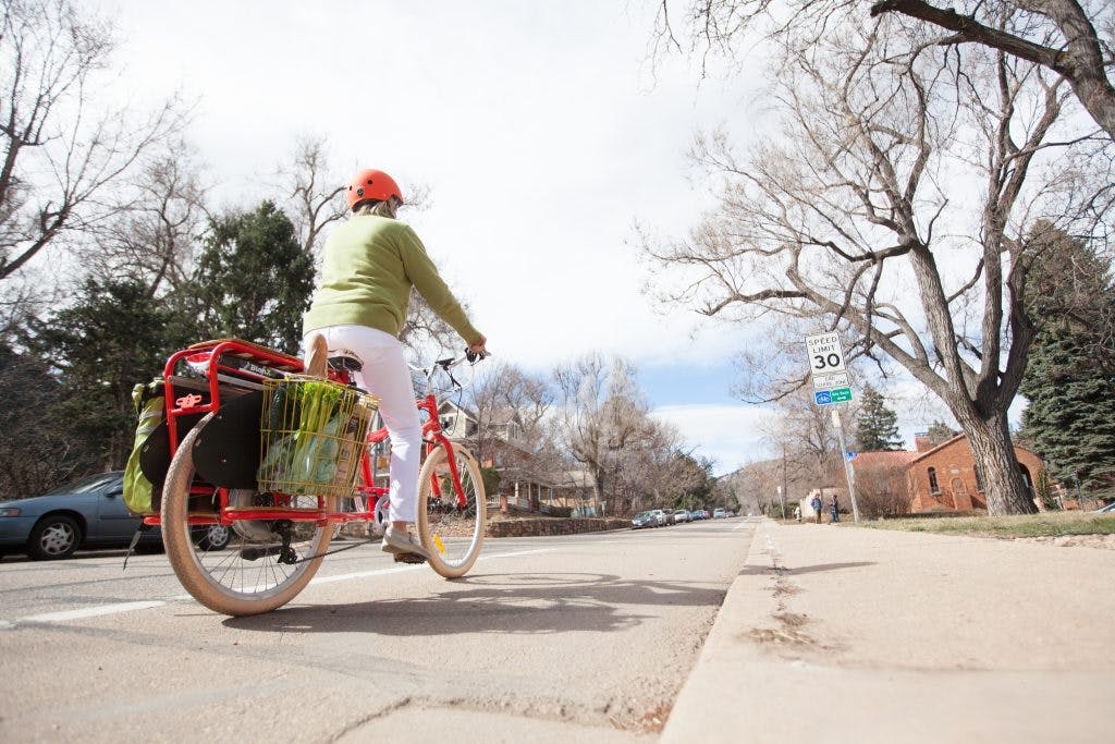 Riding an electric bicycle.