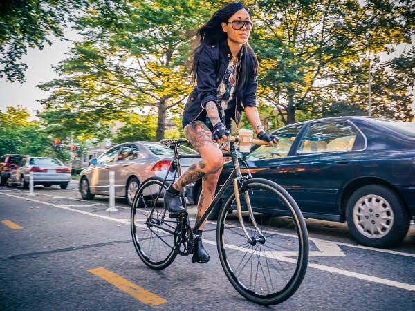 Riding in DC’s protected bike lane on 15th Street. Photo: Stewart Eastep.