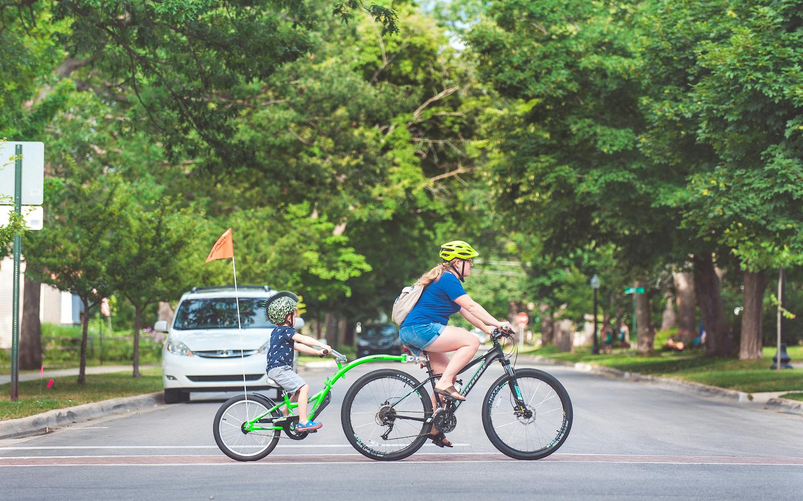 A female bicyclist and child in Traverse City, Michigan. Photo by Gary Howe.