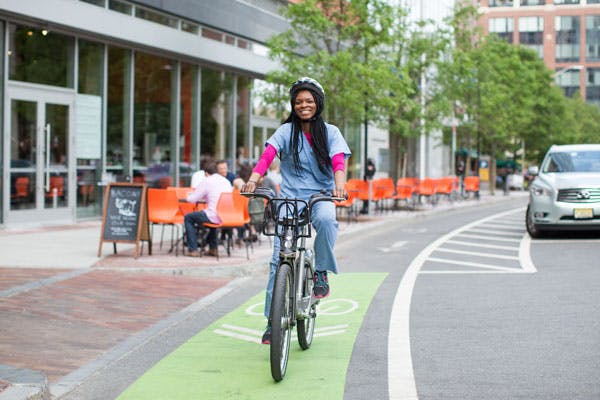 A doctor commutes to work by bicycle.