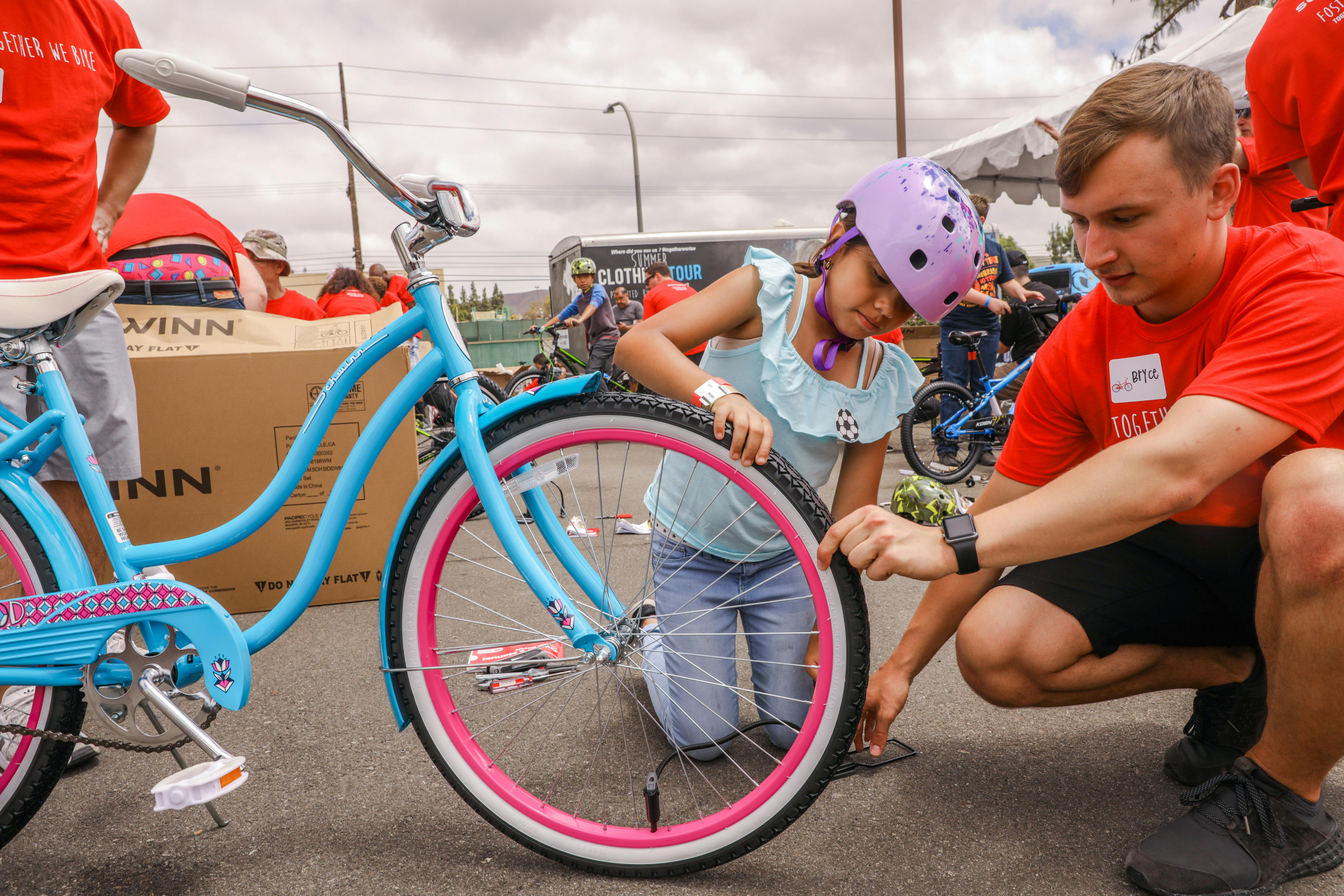 Getting a young rider acquainted with her new bicycle.