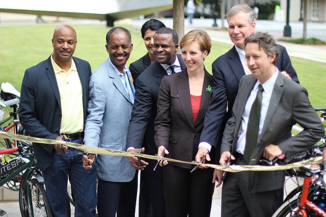 Atlanta leaders cut the ribbon on an important new bikeway connection, a raised green lane in Midtown.