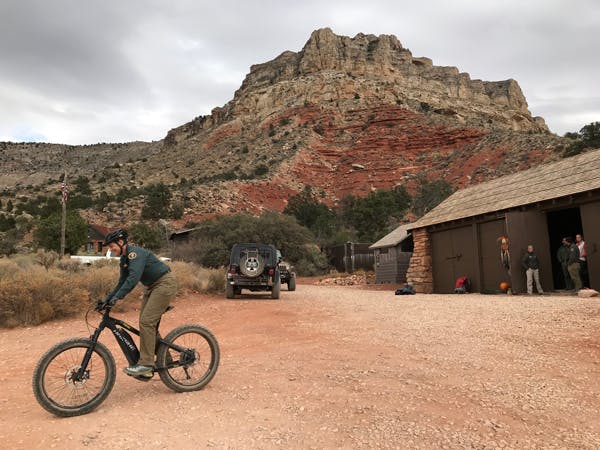 Todd Seliga, backcountry ranger for the Tuweep area of Grand Canyon National Park, tries out a eMTB.