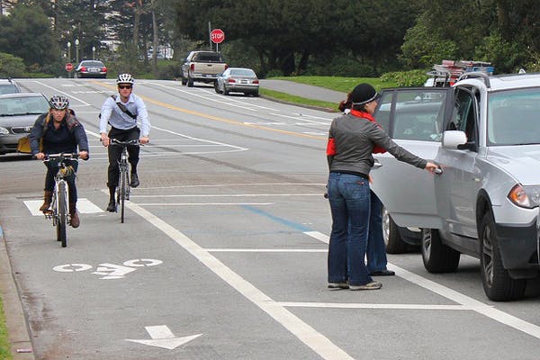 parked cars as a bike lane barrier