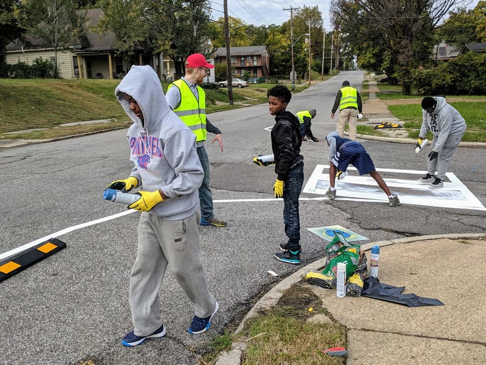 Painting a bike lane in Memphis.