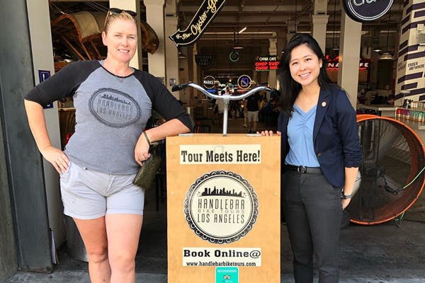 (Right to left) Jade Suh, field staff for Senator Dianne Feinstein (CA) poses with Founder and Owner of Handlebar Bike Tours LA, Jennifer Nutting