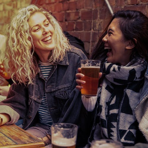 Two ladies having a beer