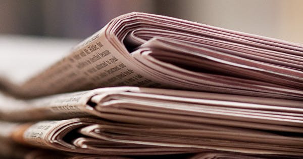 A stack of New York Times newspapers