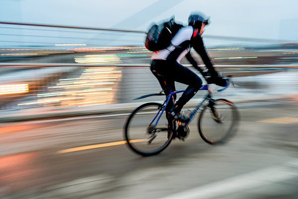 A rider commutes by bicycle.