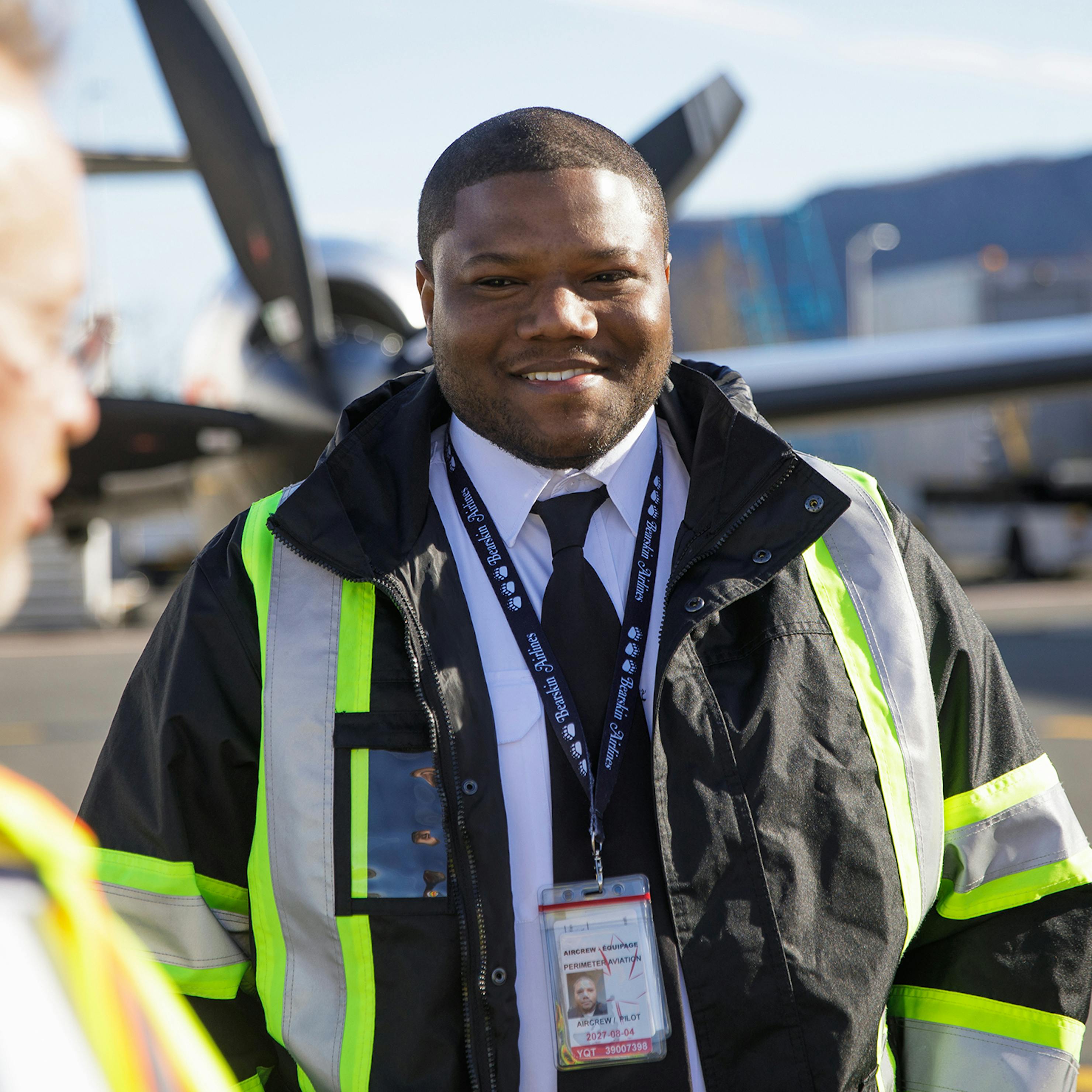 First officer smiling at Captain.