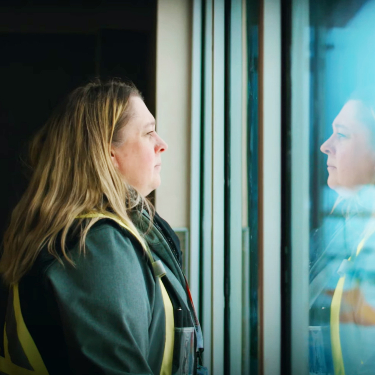 Northern Stations manager looking out a window.
