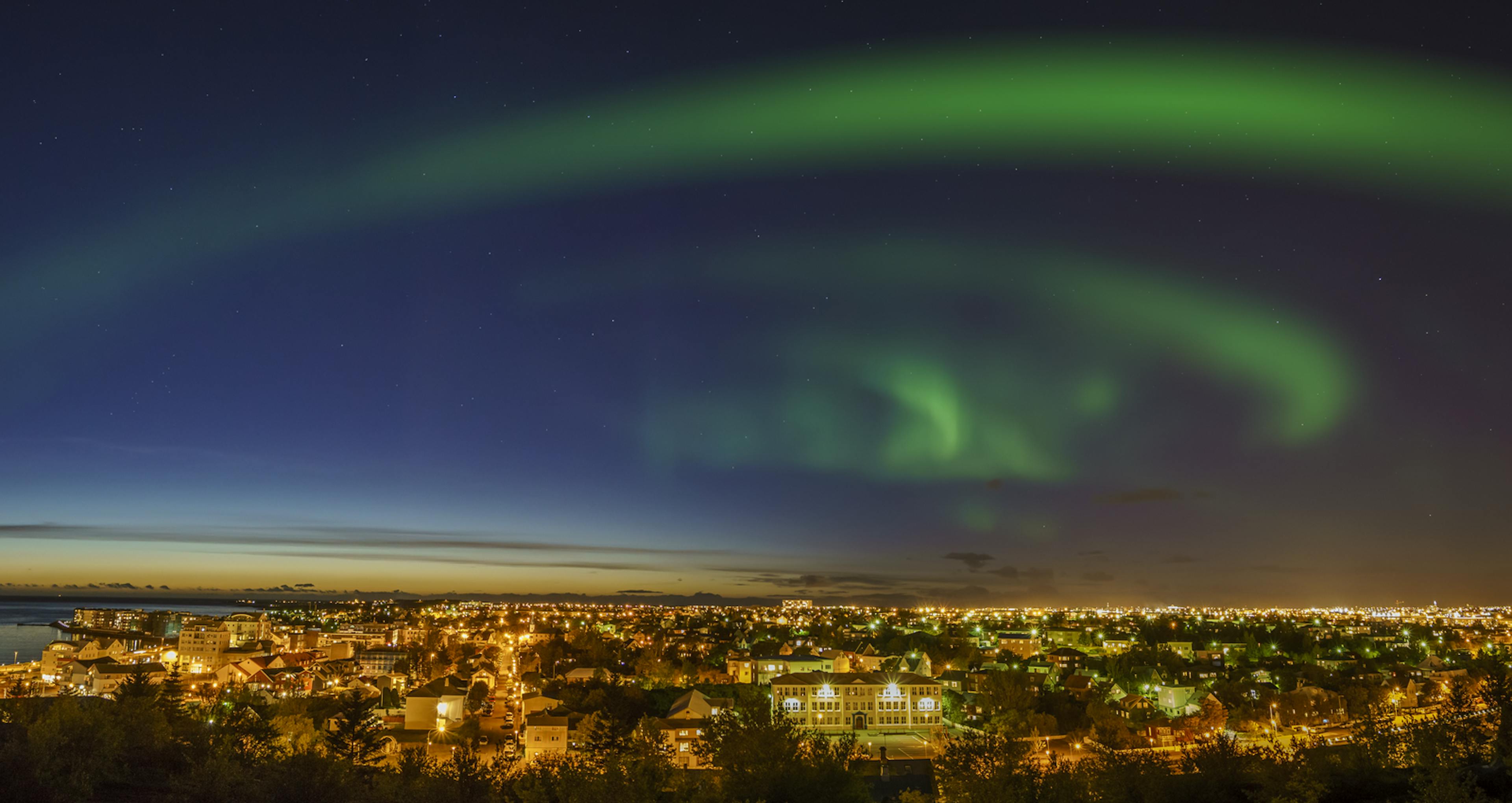 Northern lights over Reykjavik city