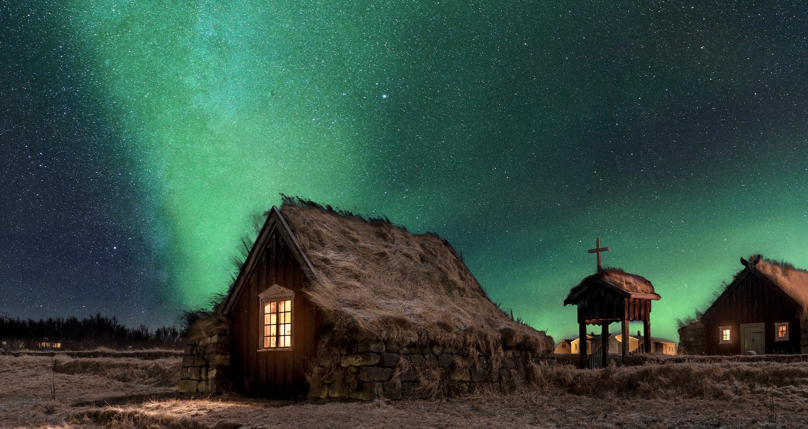 Northern lights over small cottage in Iceland
