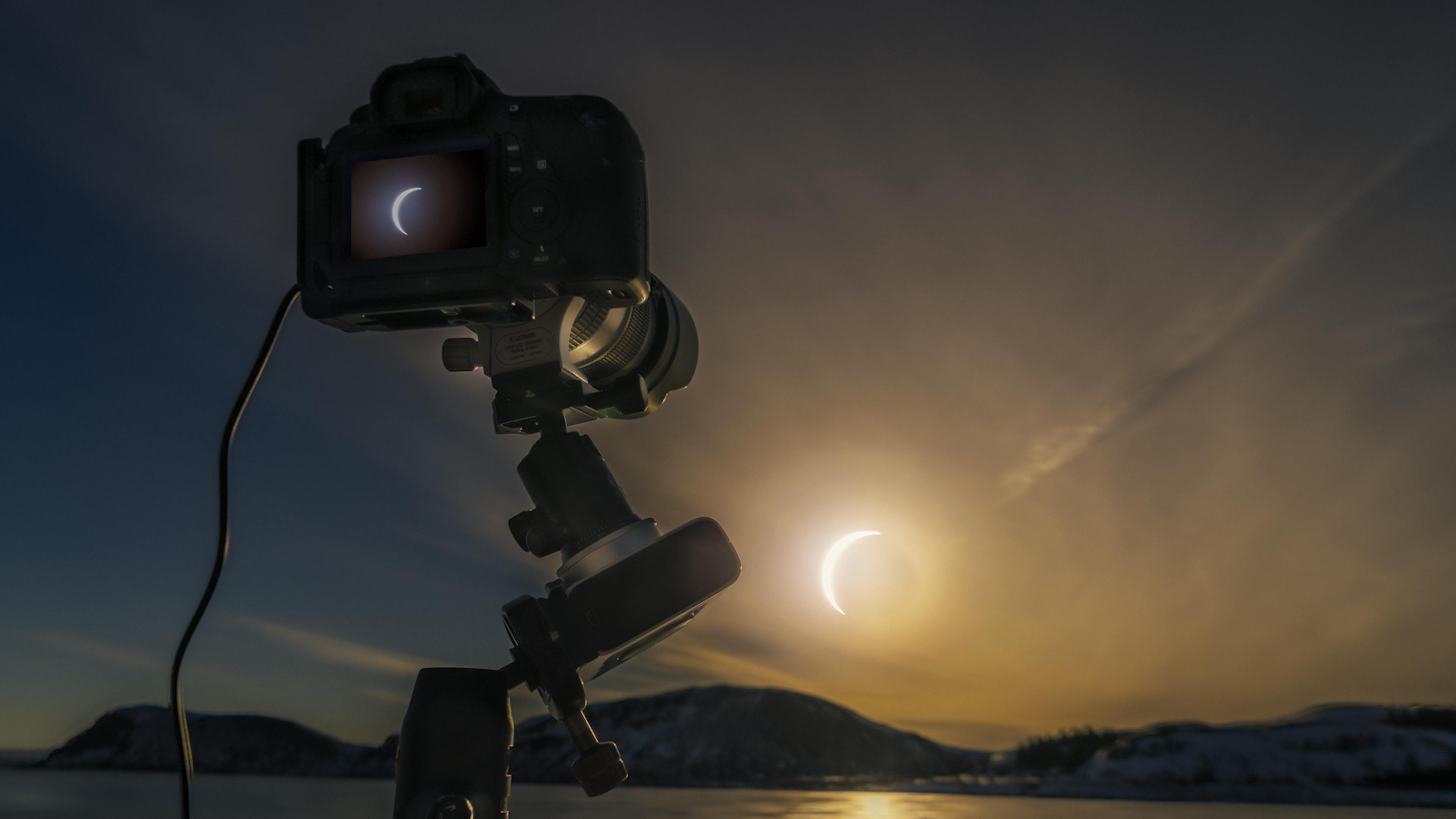 Camera taking a photo of the solar eclipse