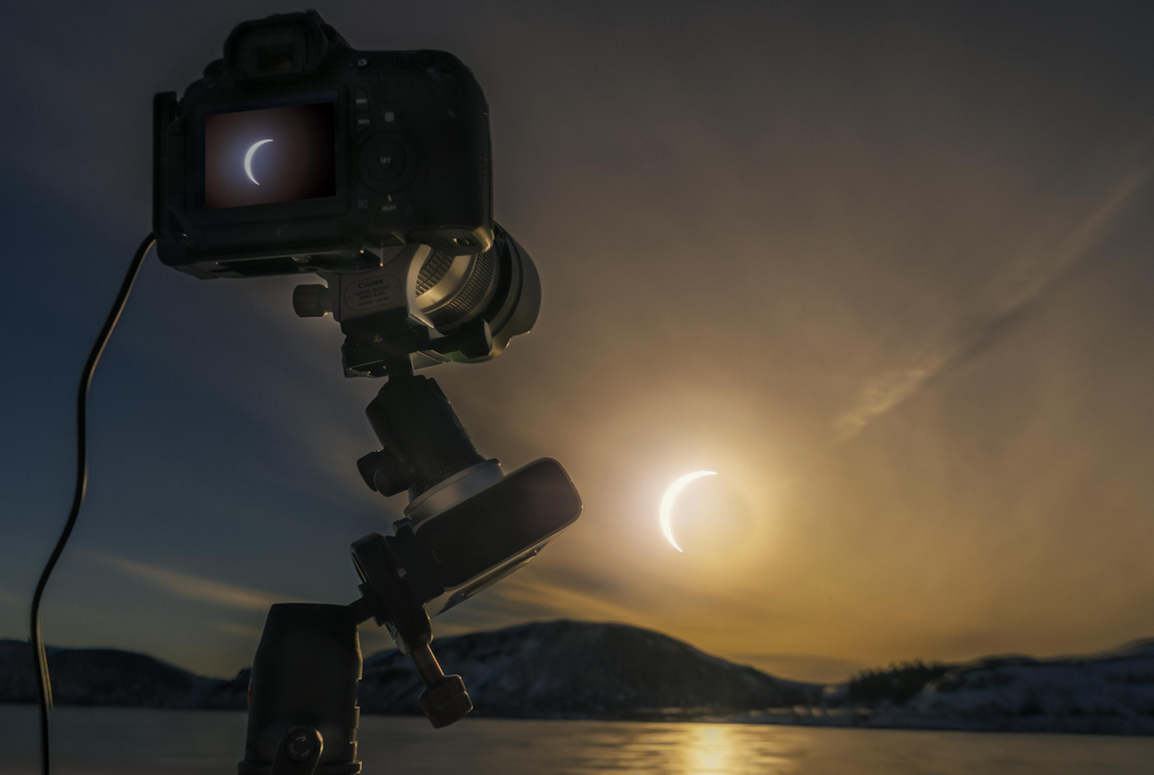 Camera taking a photo of the solar eclipse