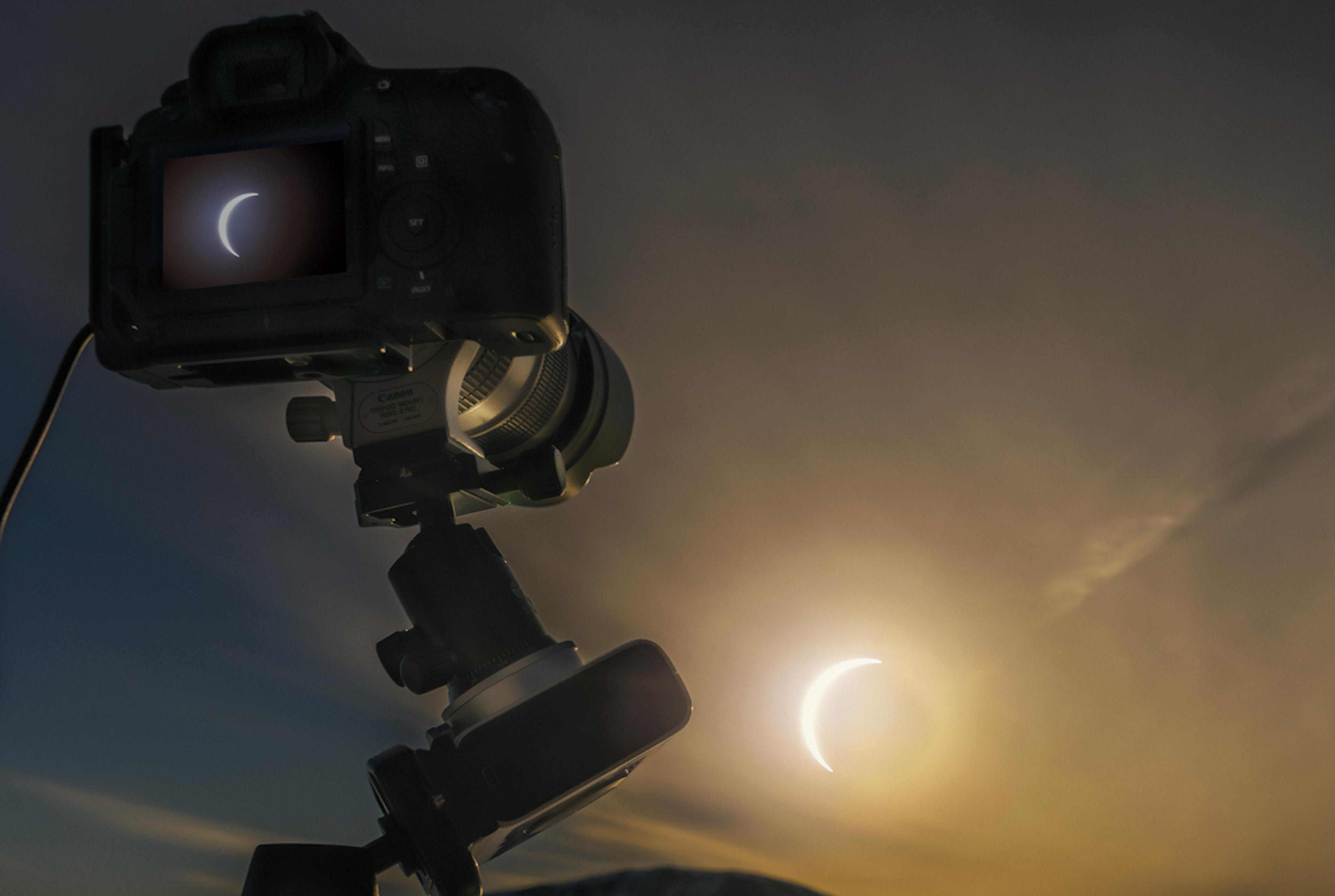 Camera taking a photo of the solar eclipse