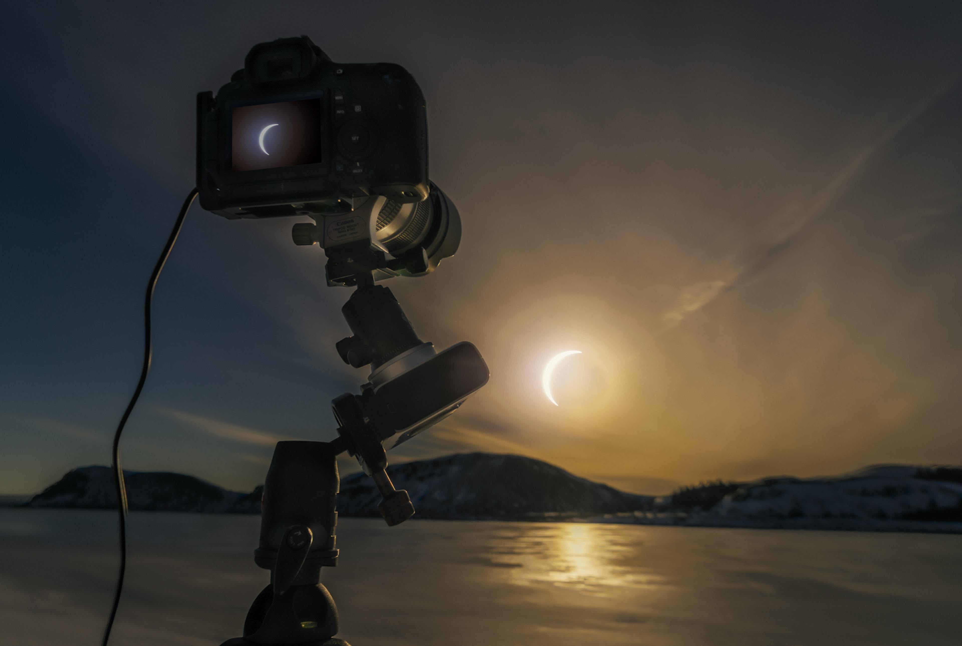 Camera taking a photo of the solar eclipse