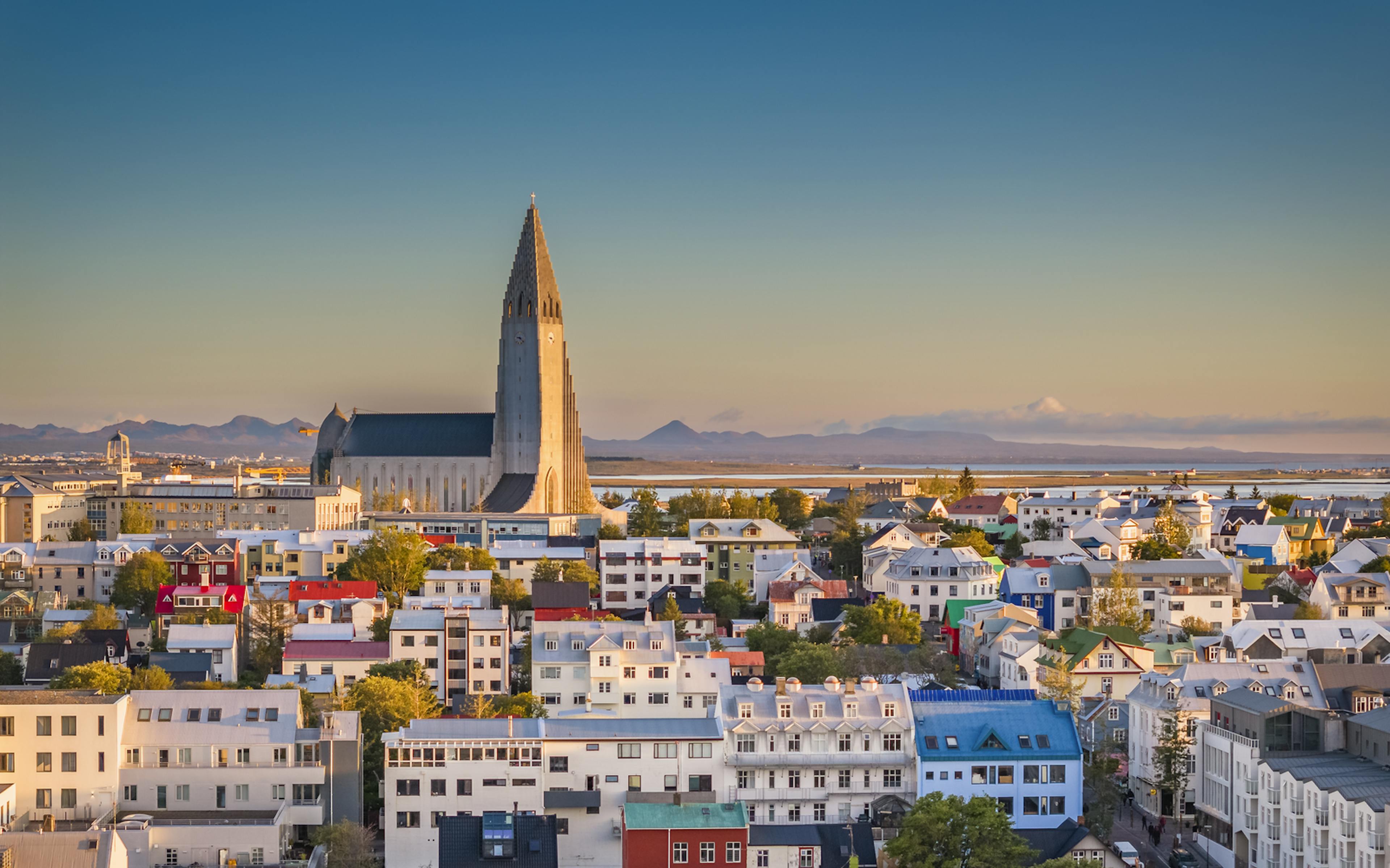 hallgrímskirkja overlooking town during dusk