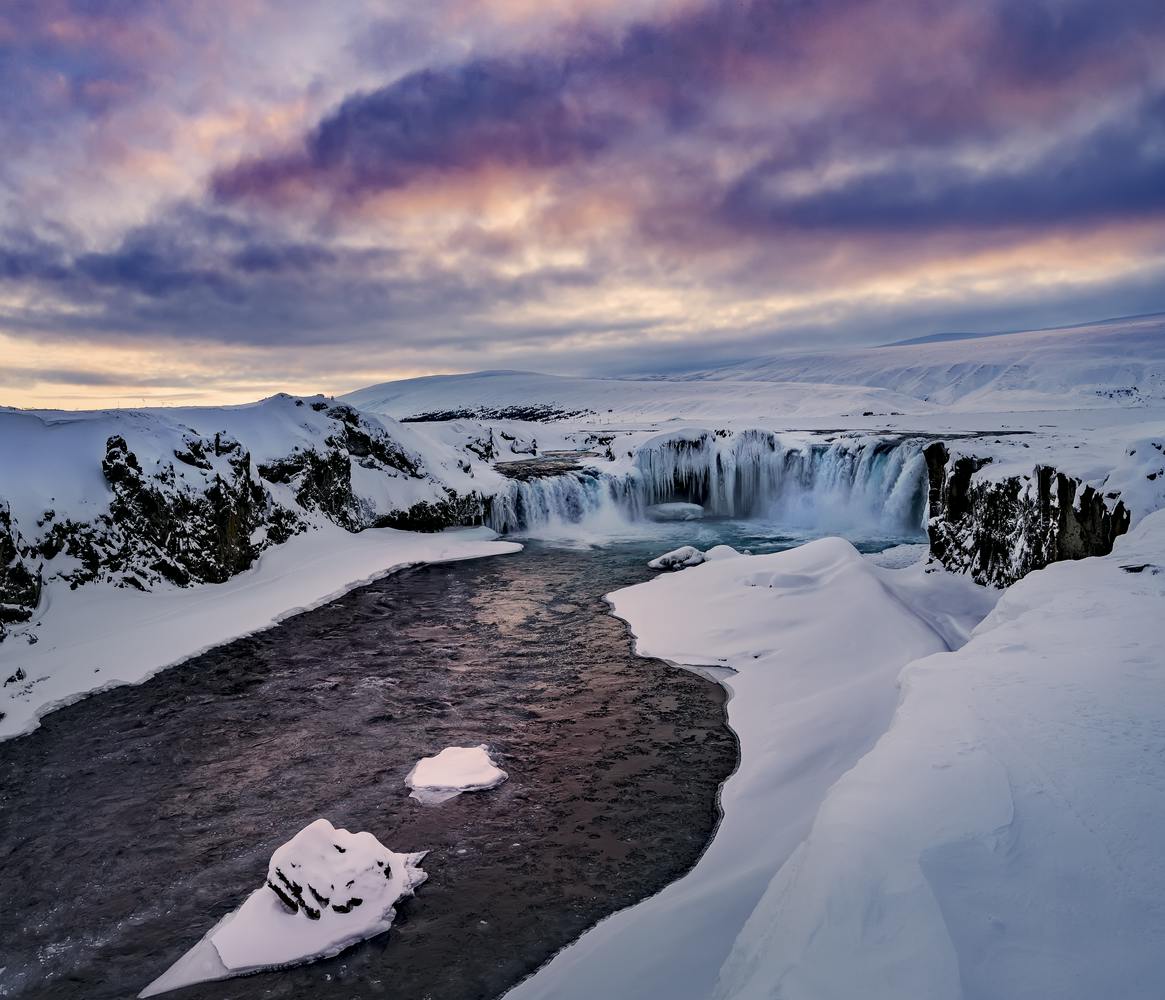 Hrafnabjargarfoss waterfall in the winter with snow