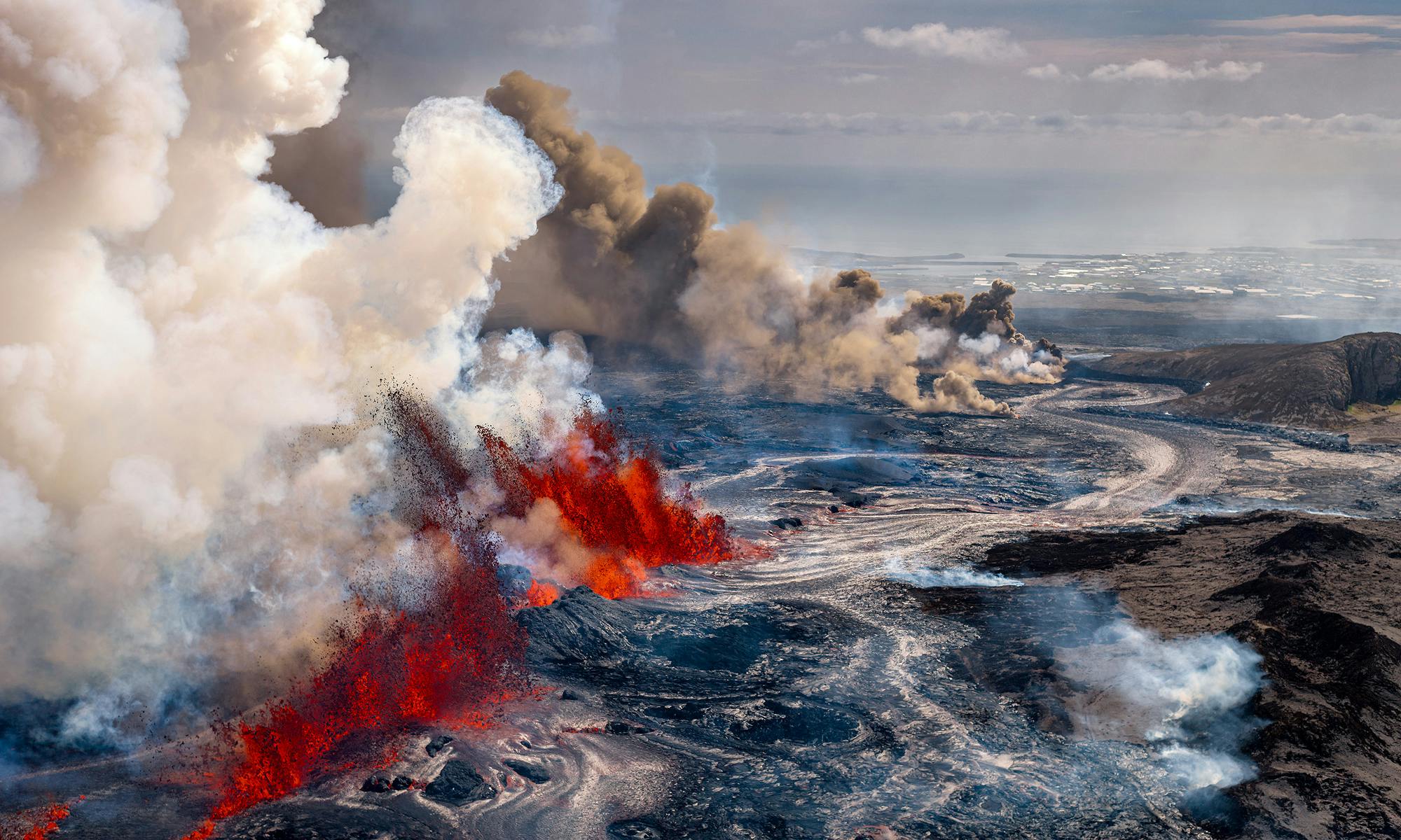 Arial shot of lava spewing out of sunhnúkagígar crater row eruption