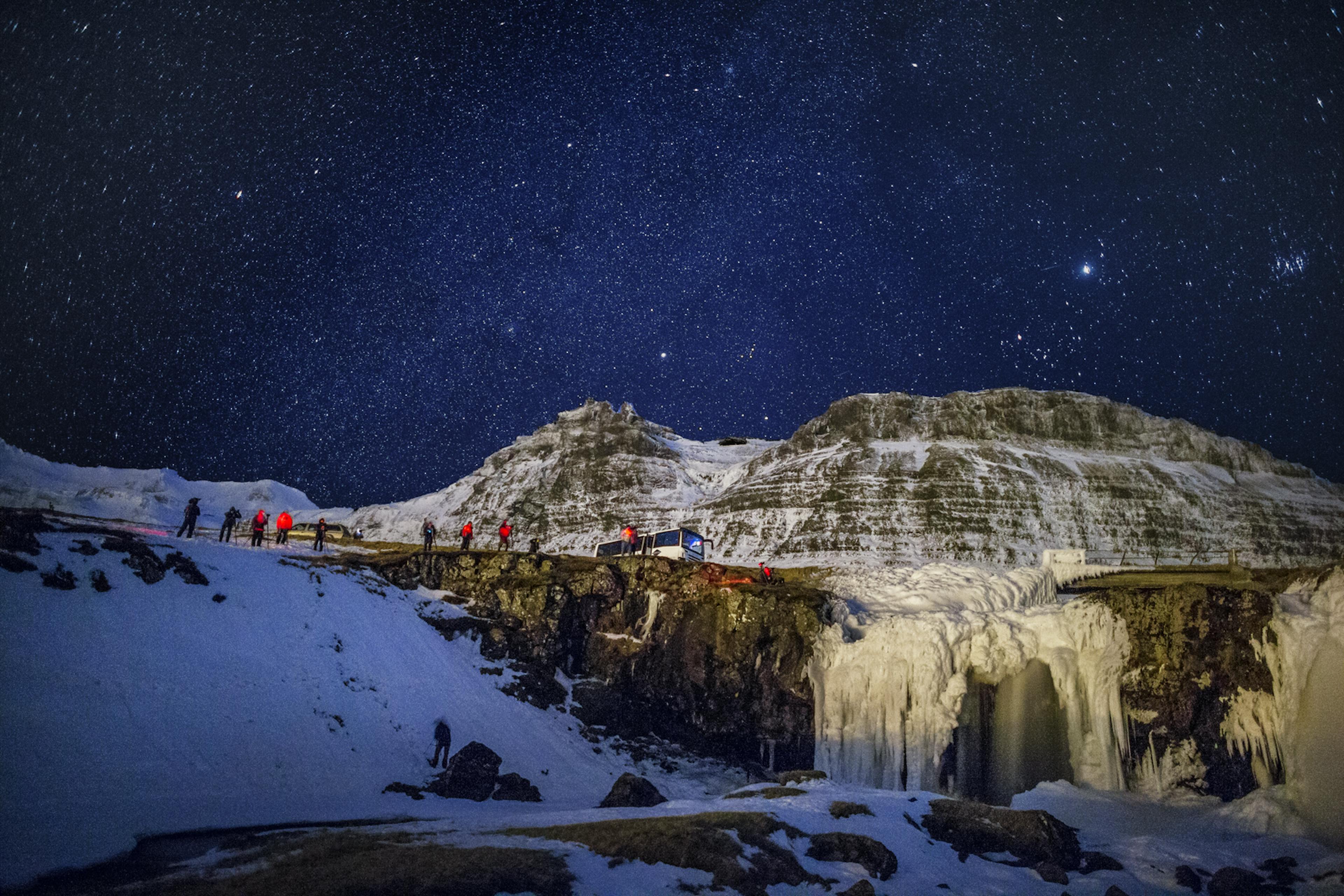 starry sky above Kirkjufellsfoss Waterfall