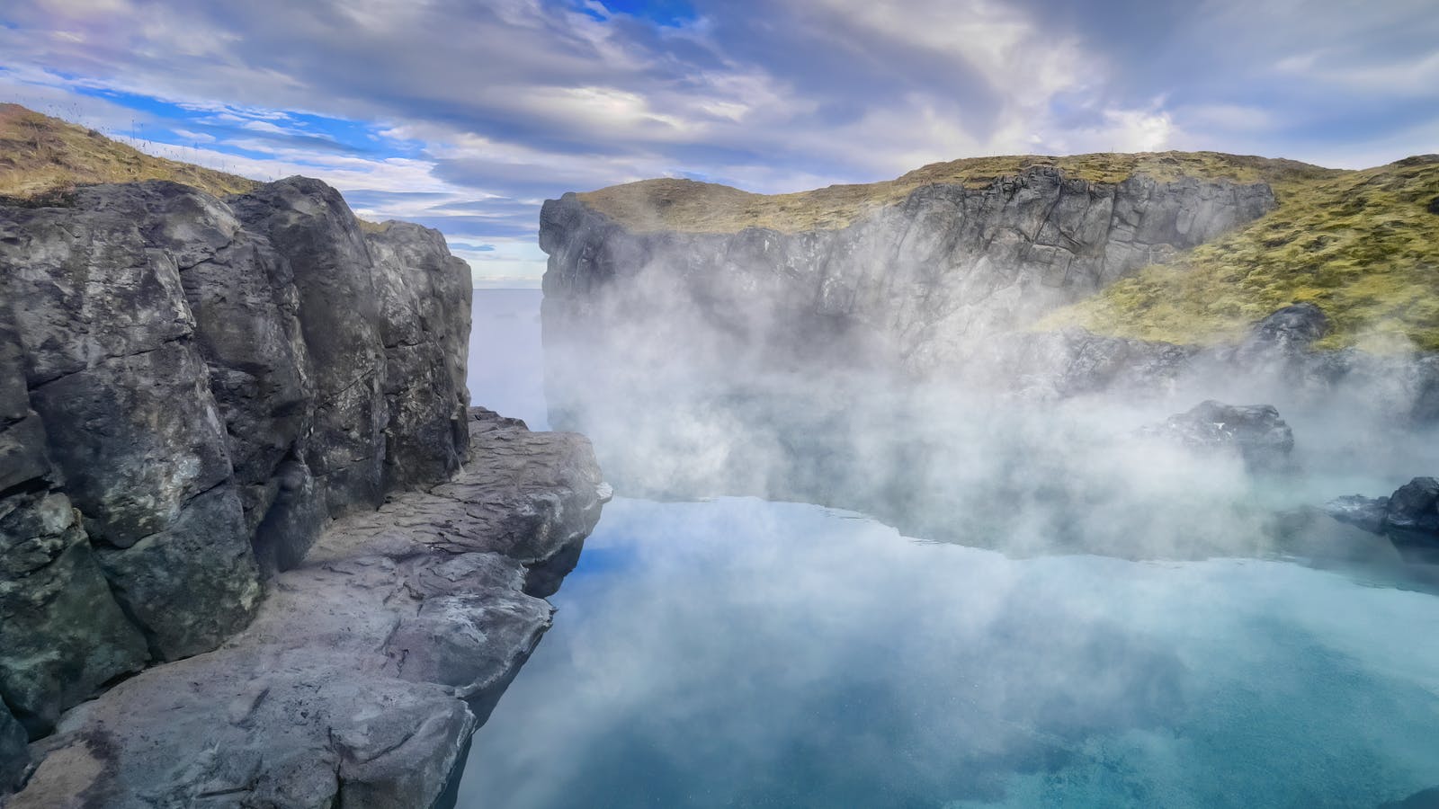 Sky Lagoon between cliffs
