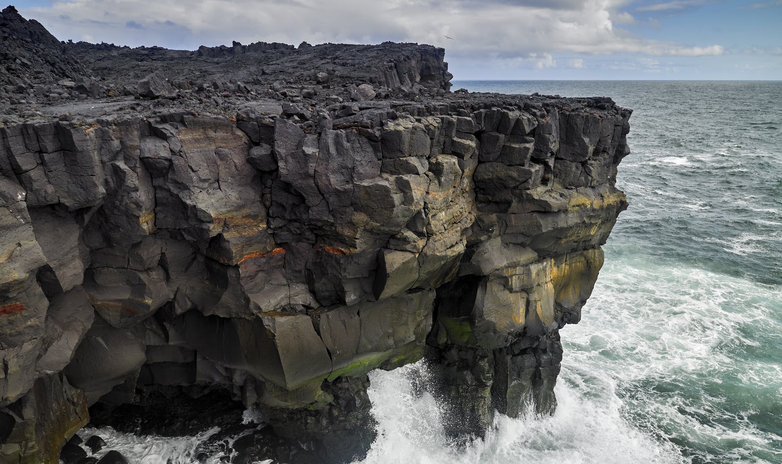 Waves crushing over shores of Surtsey island