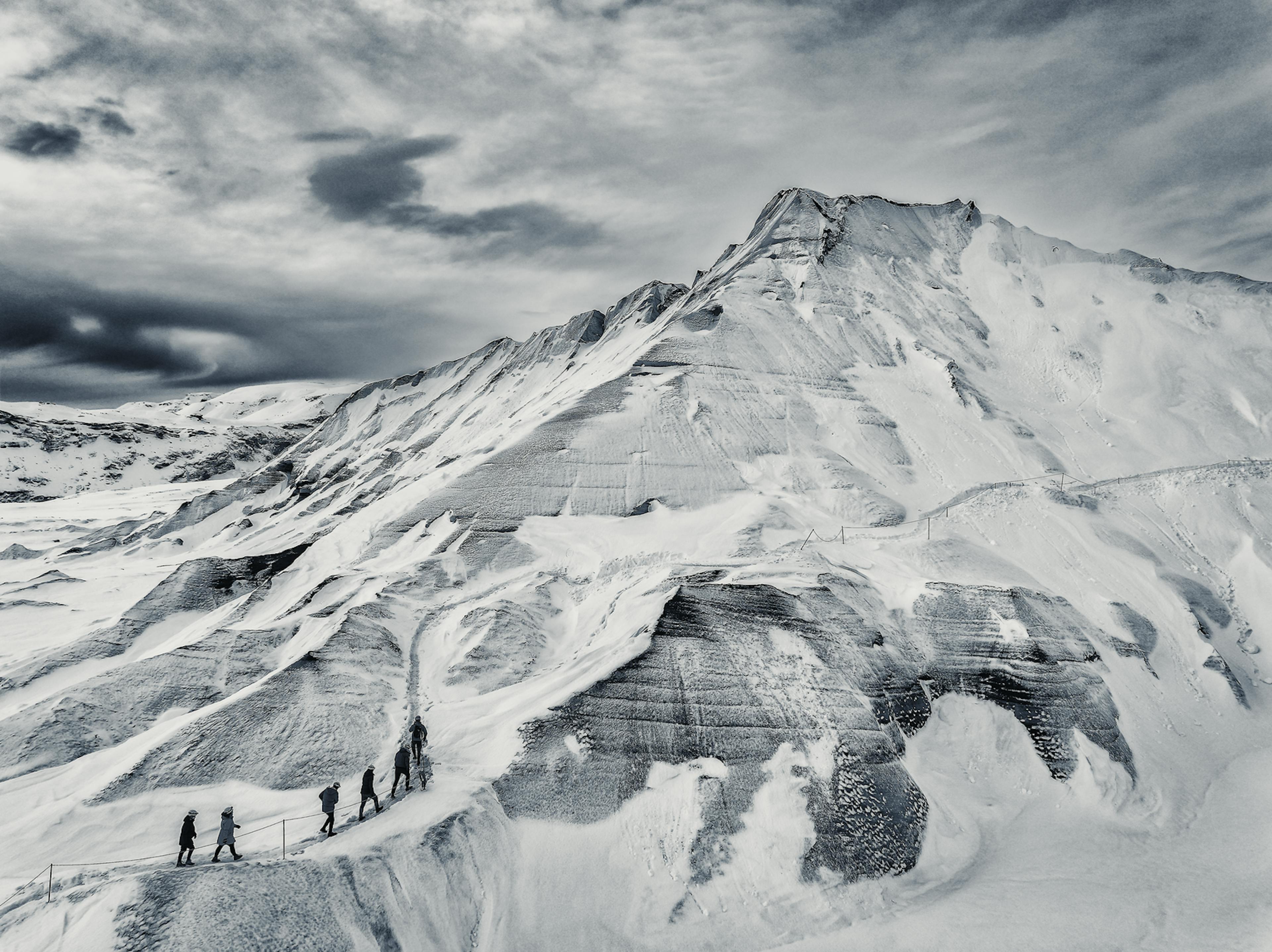 a composite volcano covered in snow