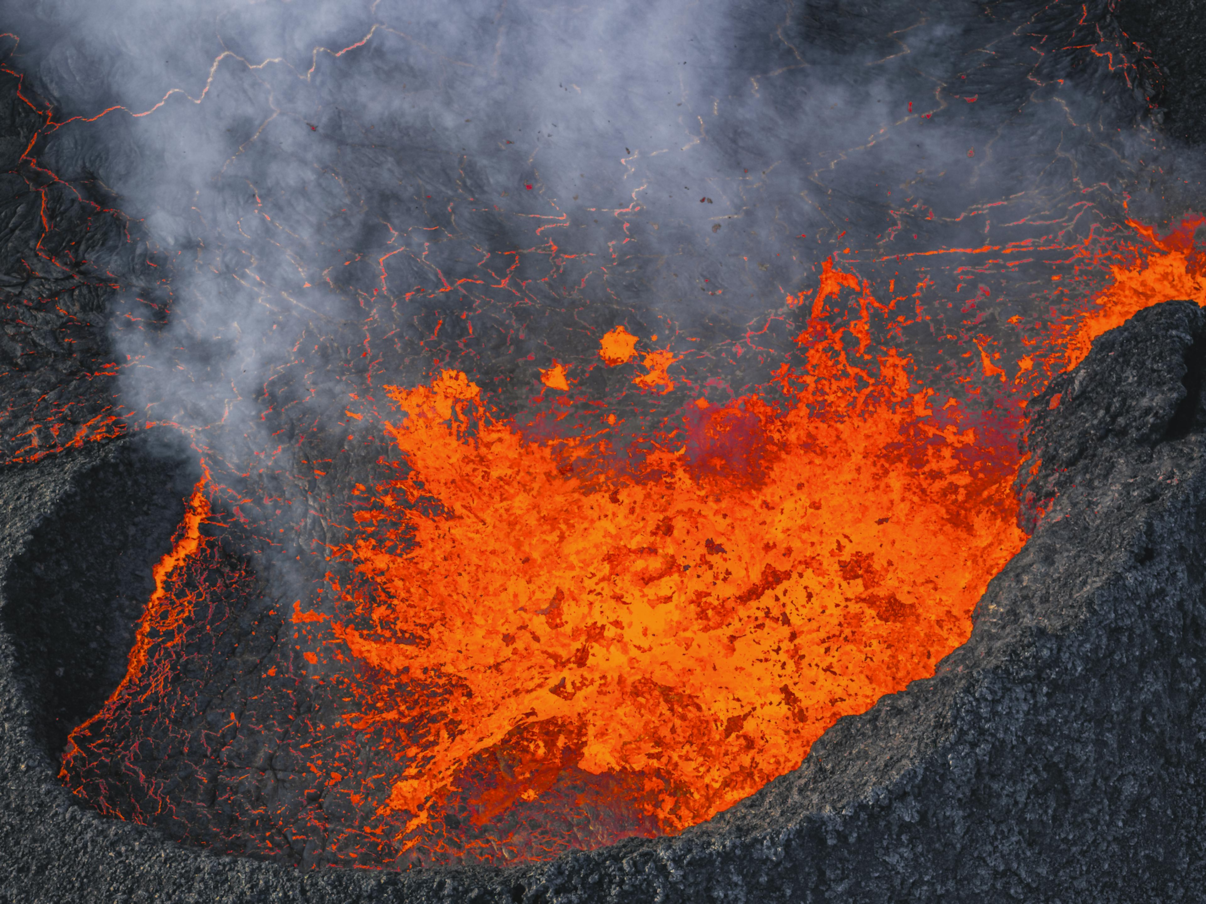 Lava bursting out of volcanic crater