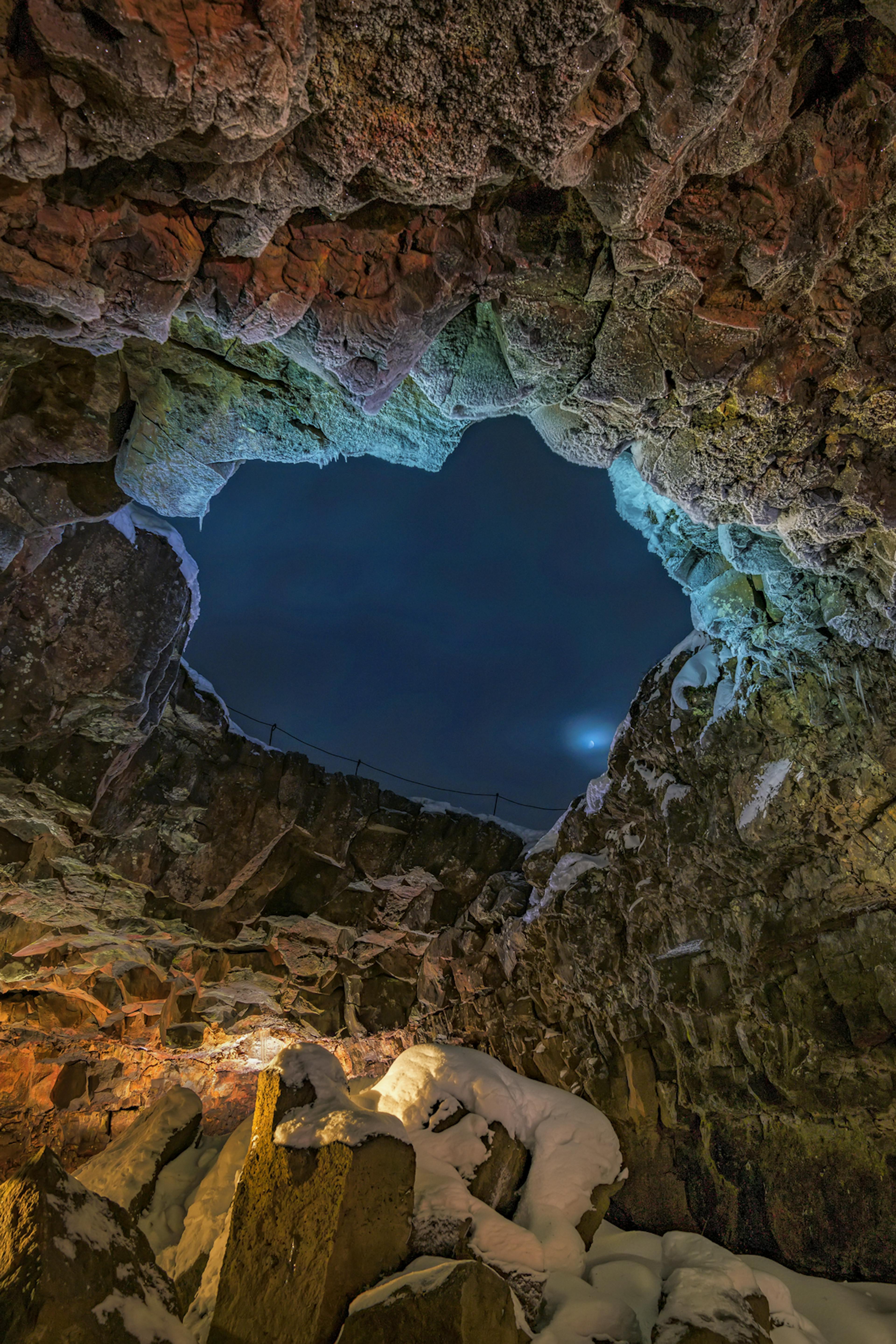 Lava tube in Iceland with a blue opening