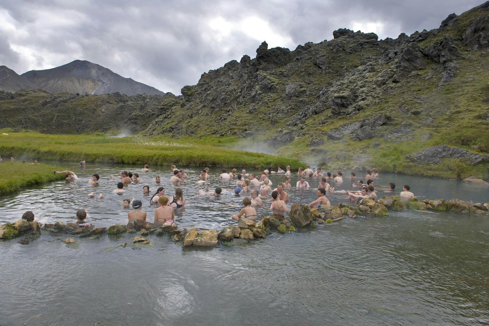 group of people bathing in hot sping in landmannalaugar
