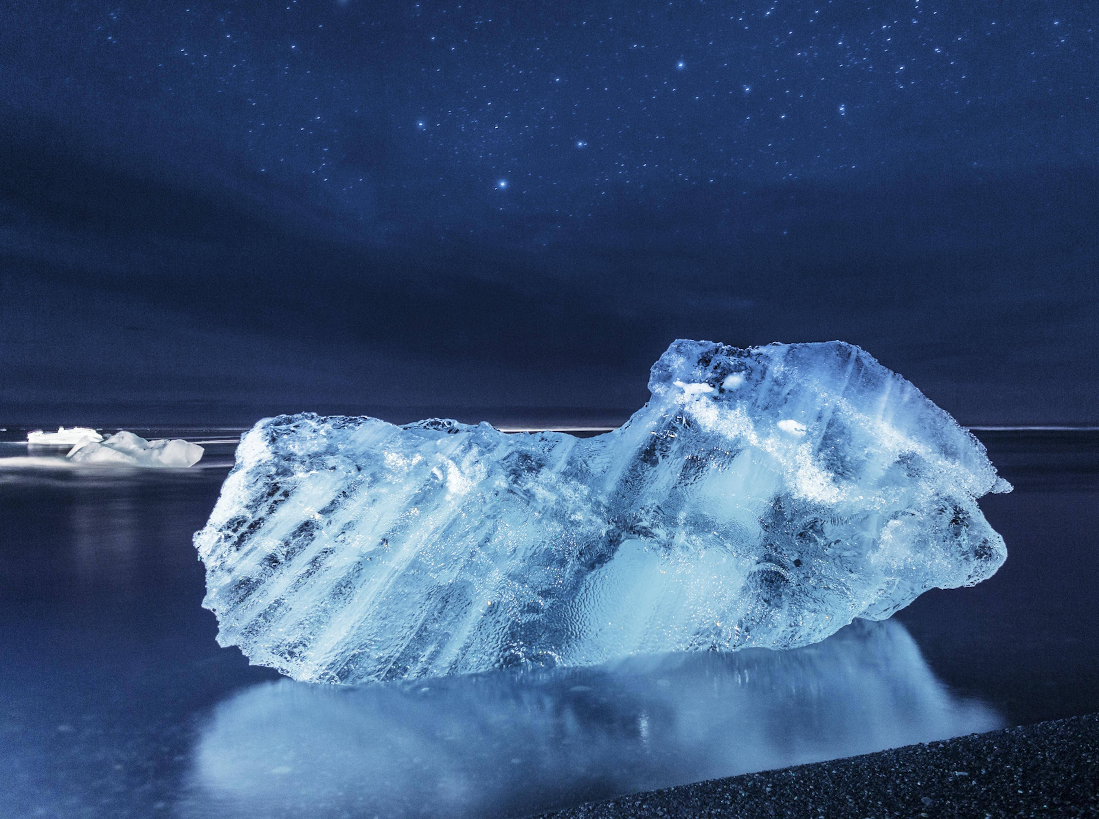 small iceberg at night at the diamond beach iceland