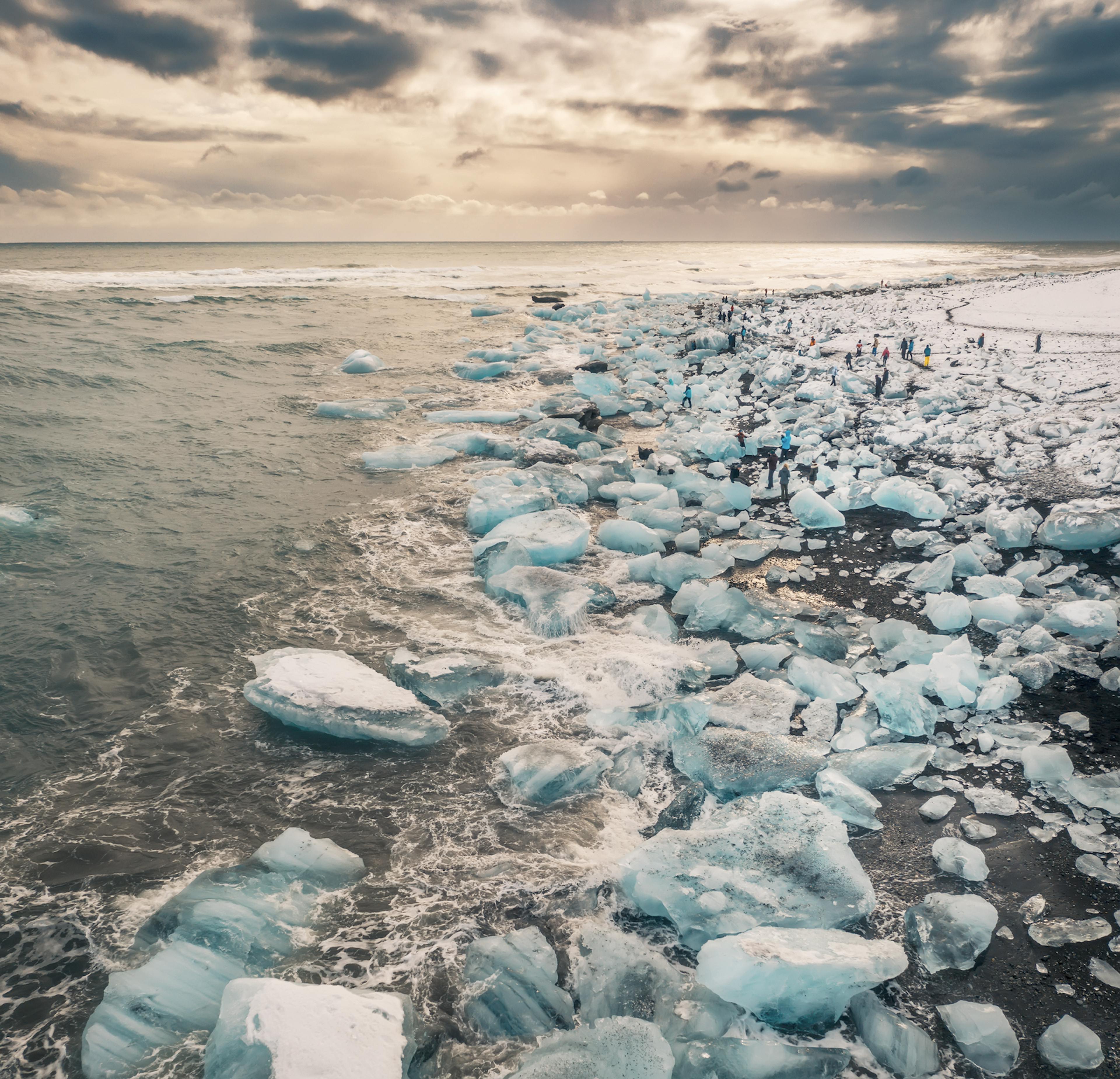 the beach with thousands of icebergs on it