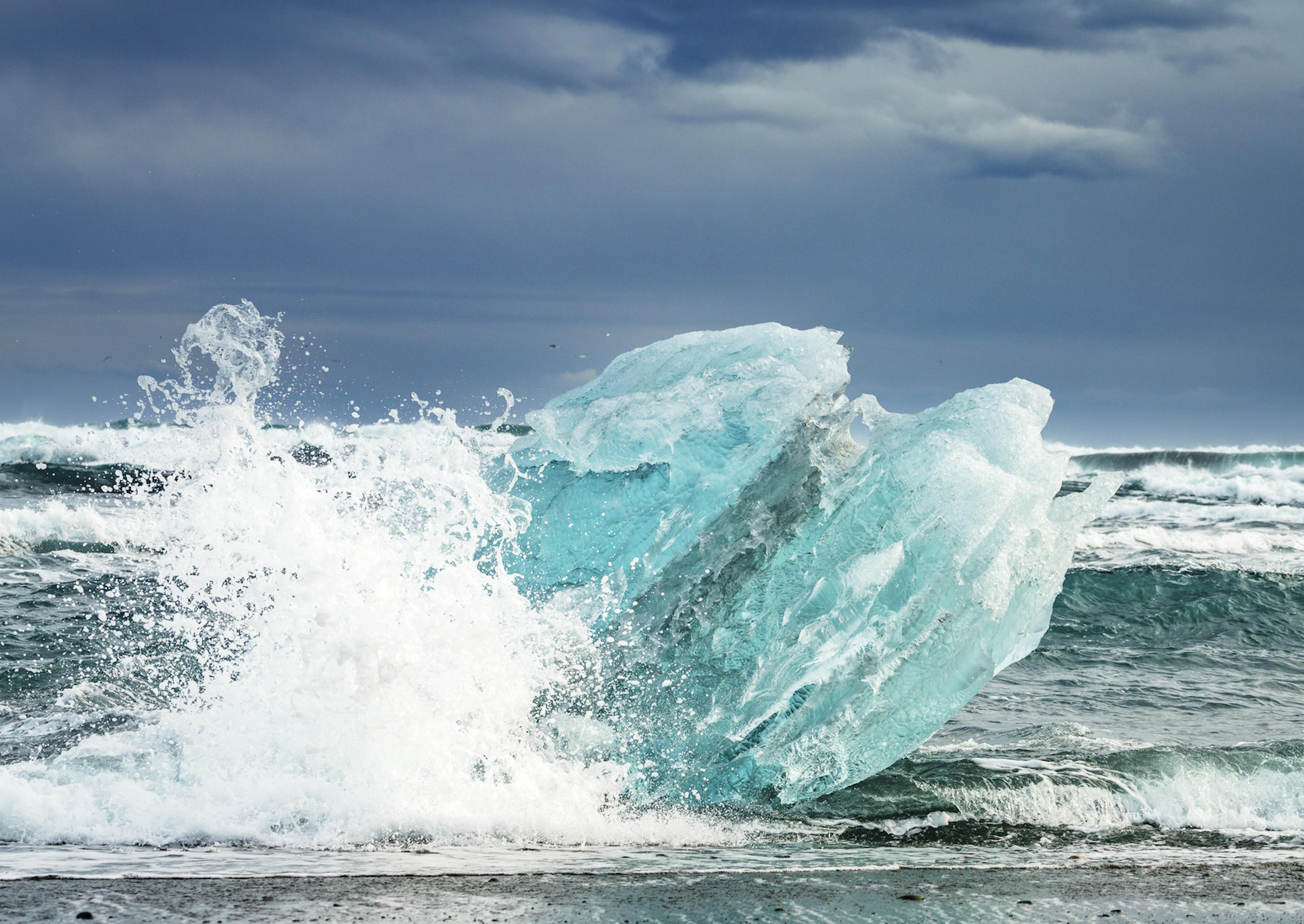 a wave crashing into icebergs