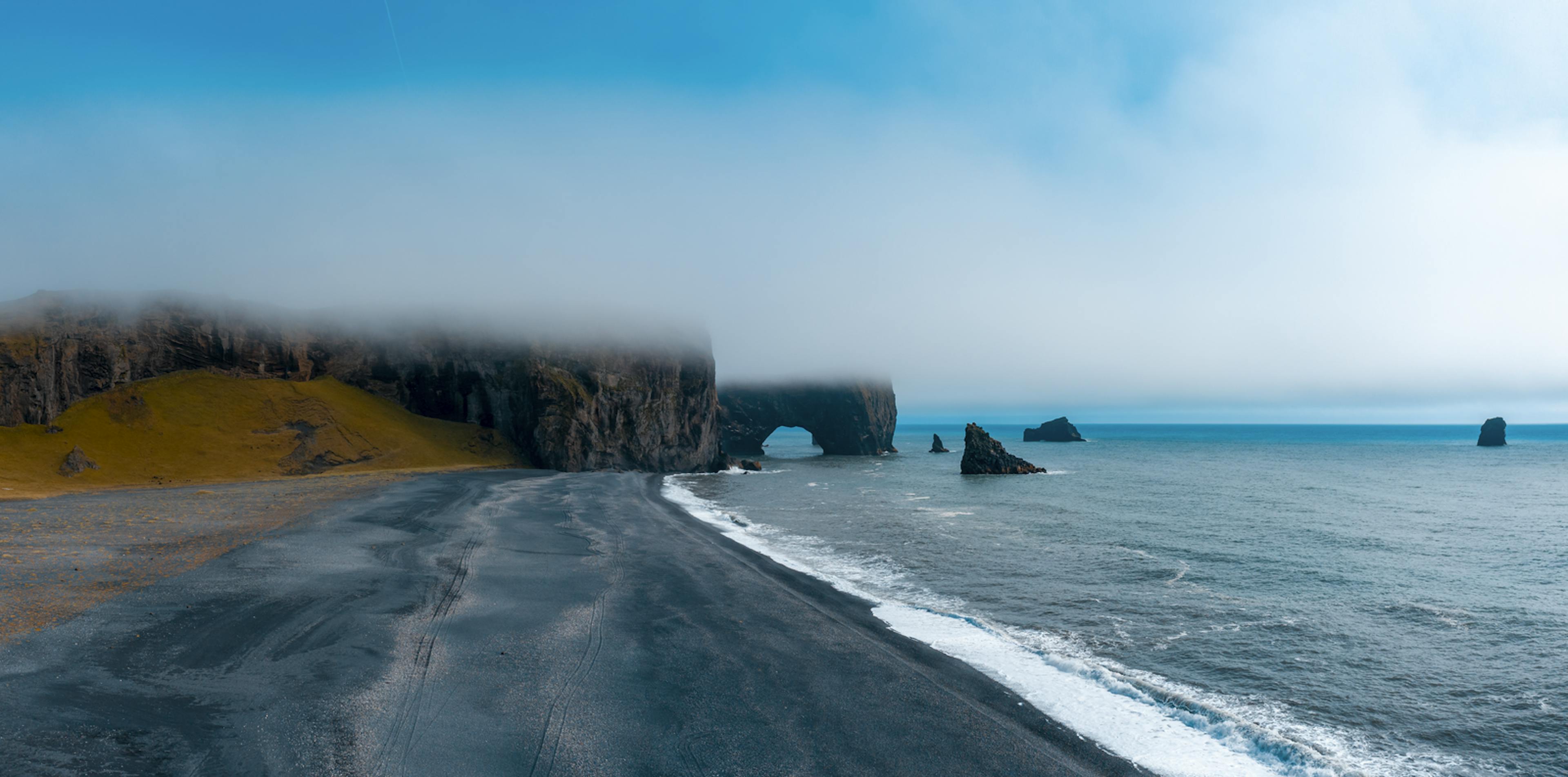 Dyrhóley beach with misty background