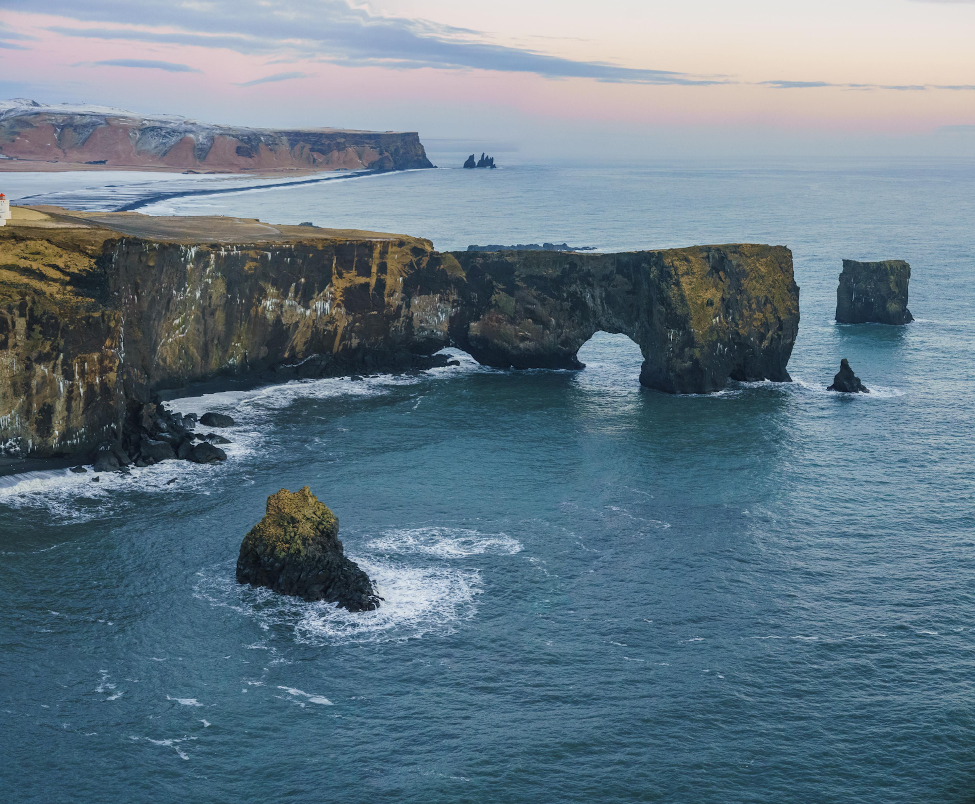Dyrhóley during sunset with blue ocean