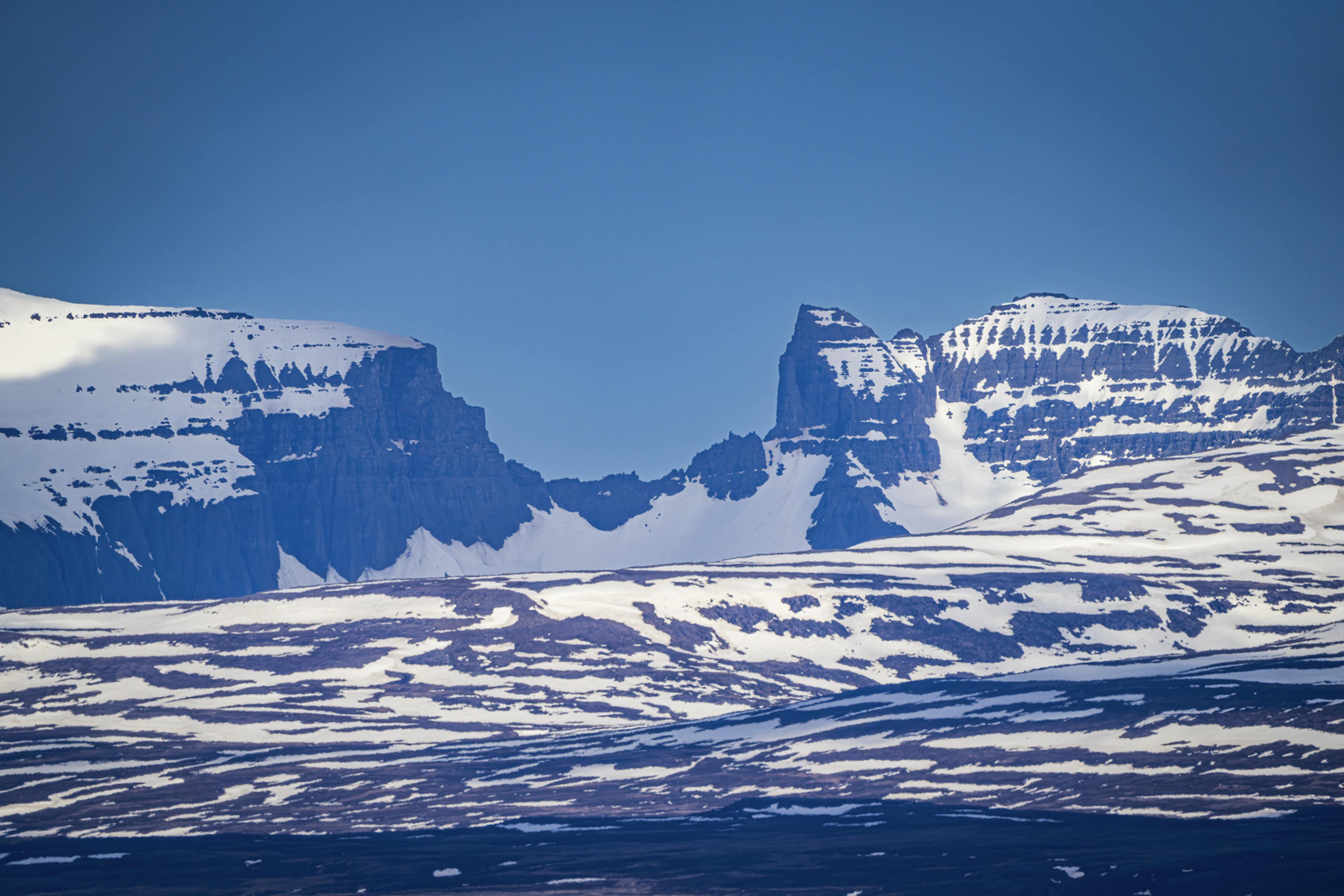 Dyrfjöll mountain range during the winter with snow