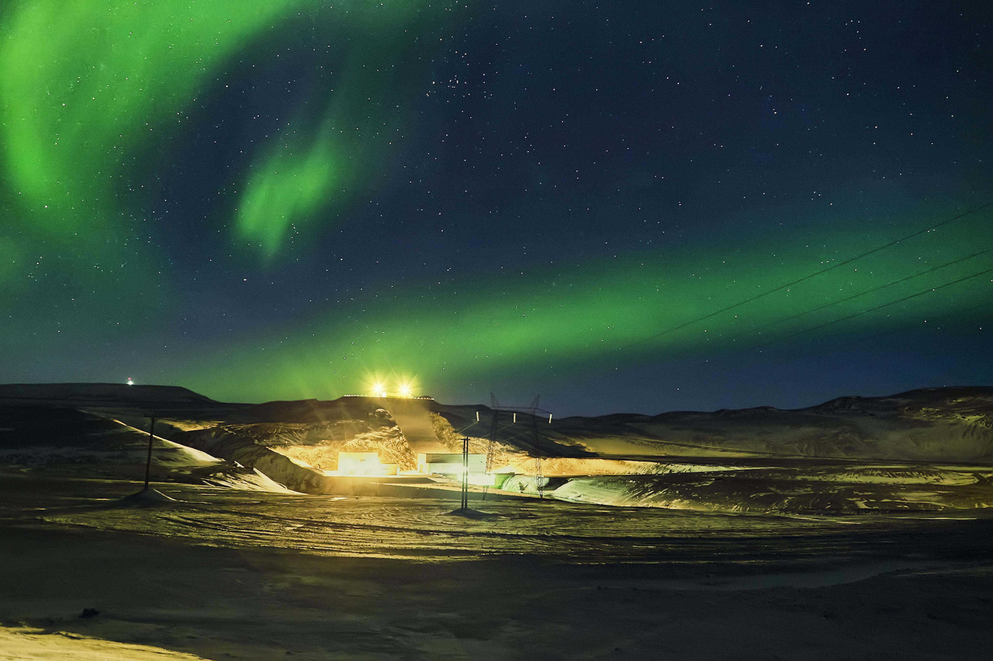 Burfellsvirkjun under the northern lights in Iceland
