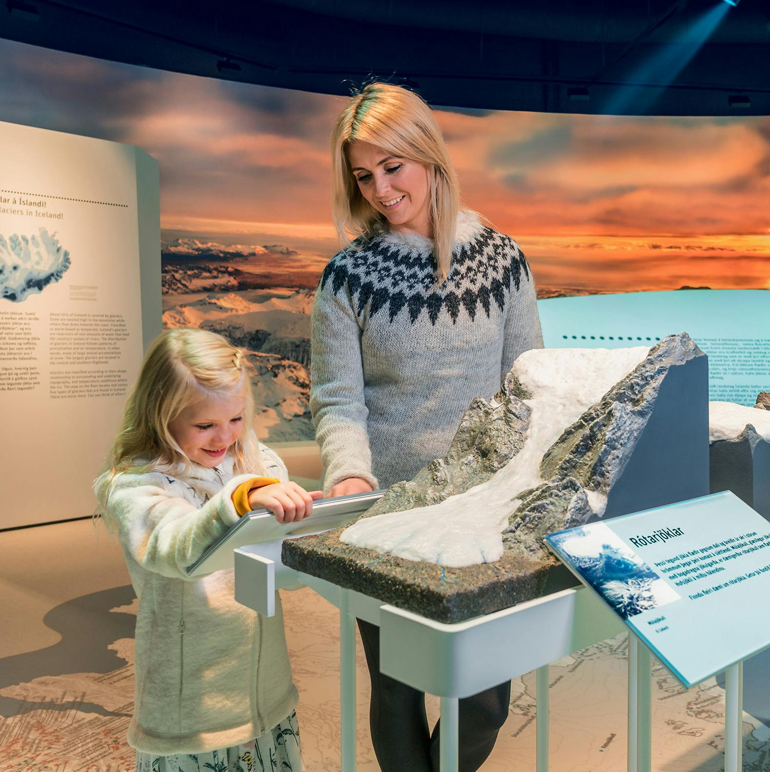 Mother and child at Glacier exhibit