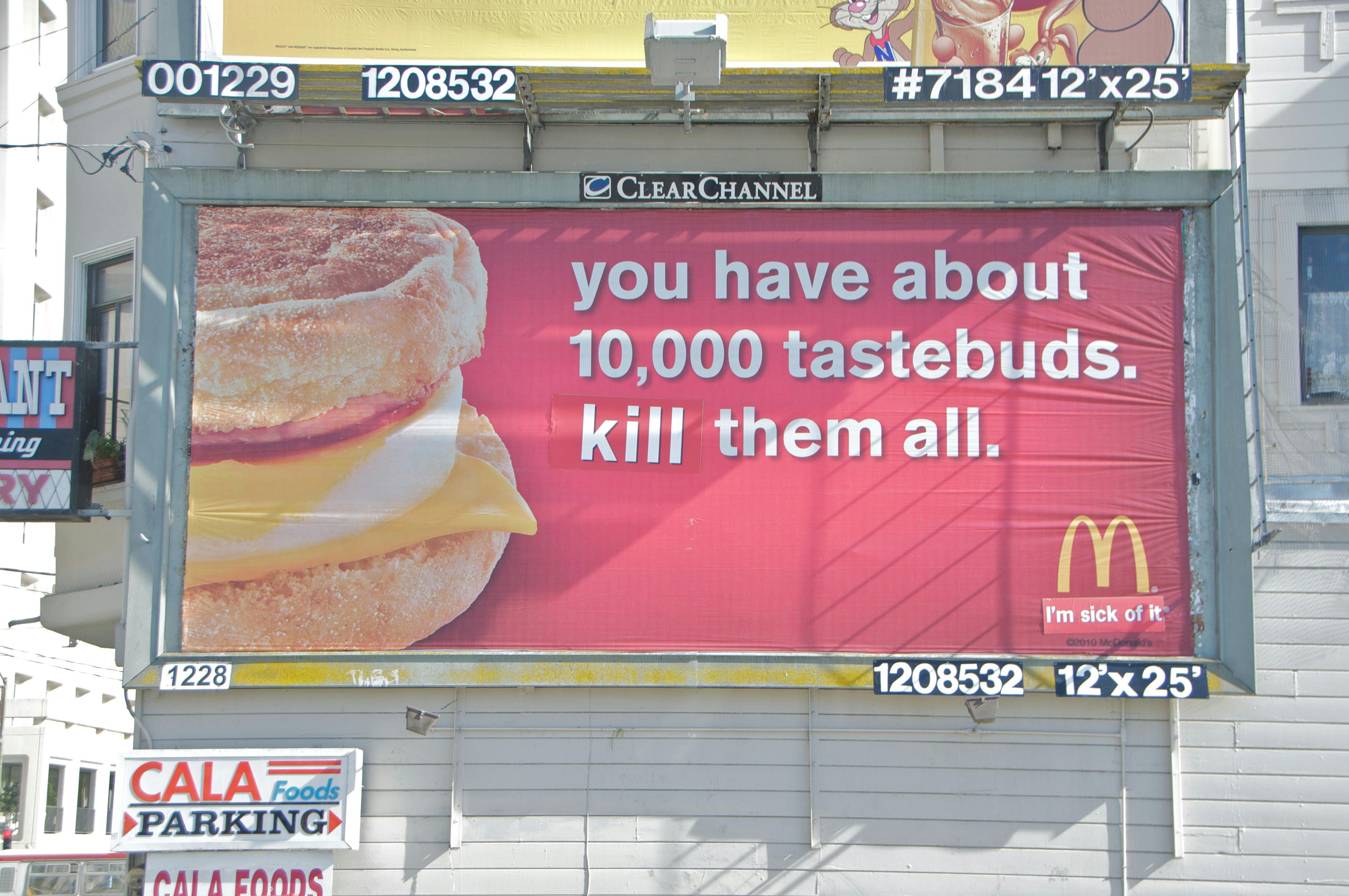 Photograph of Billboard Liberation Front McDonald's billboard, "you have about 10,000 tastebuds. kill them all."